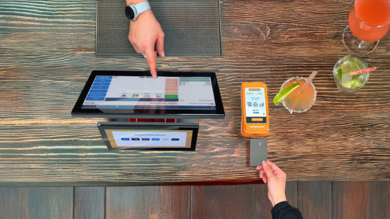 Modern EPOS system showing D3 PRO dual-display terminal and PAX A920 PRO card machine on Irish retail counter
