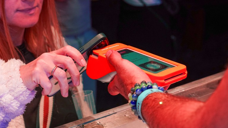 Customer making contactless payment with PAX A920 PRO terminal in Irish retail shop